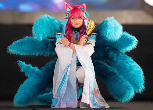 Cosplay performer in an elaborate blue costume