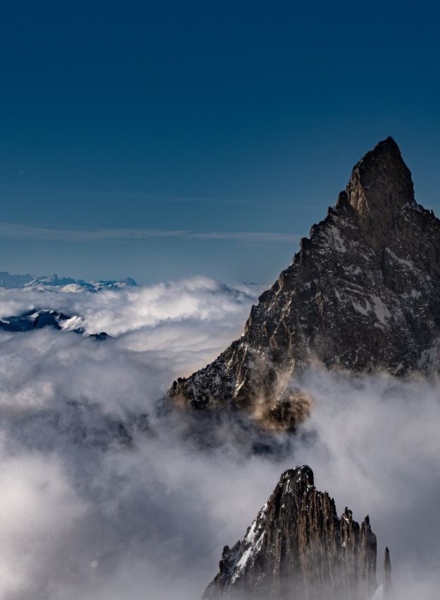 Mountain peak above the clouds