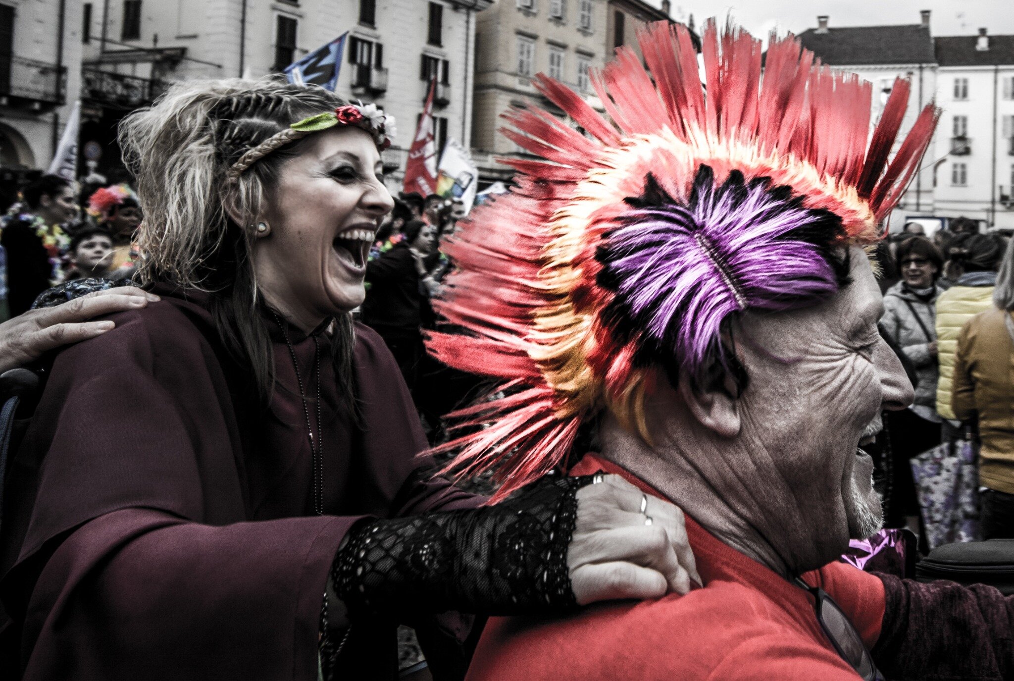 Shared laughter during a colorful street parade
